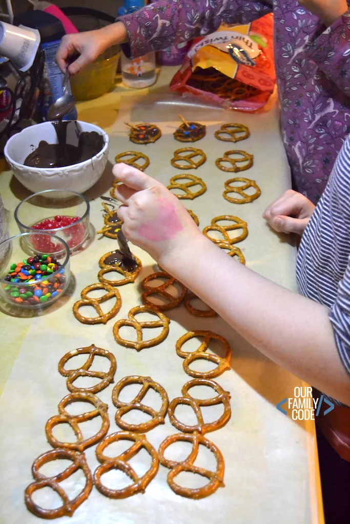 christmas cookie kid chef chocolate reindeer pretzels