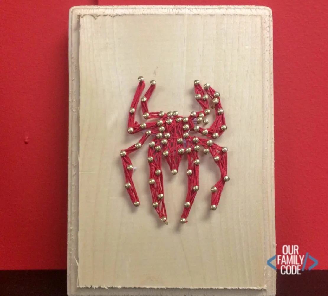 A picture of Spiderman DIY string art.