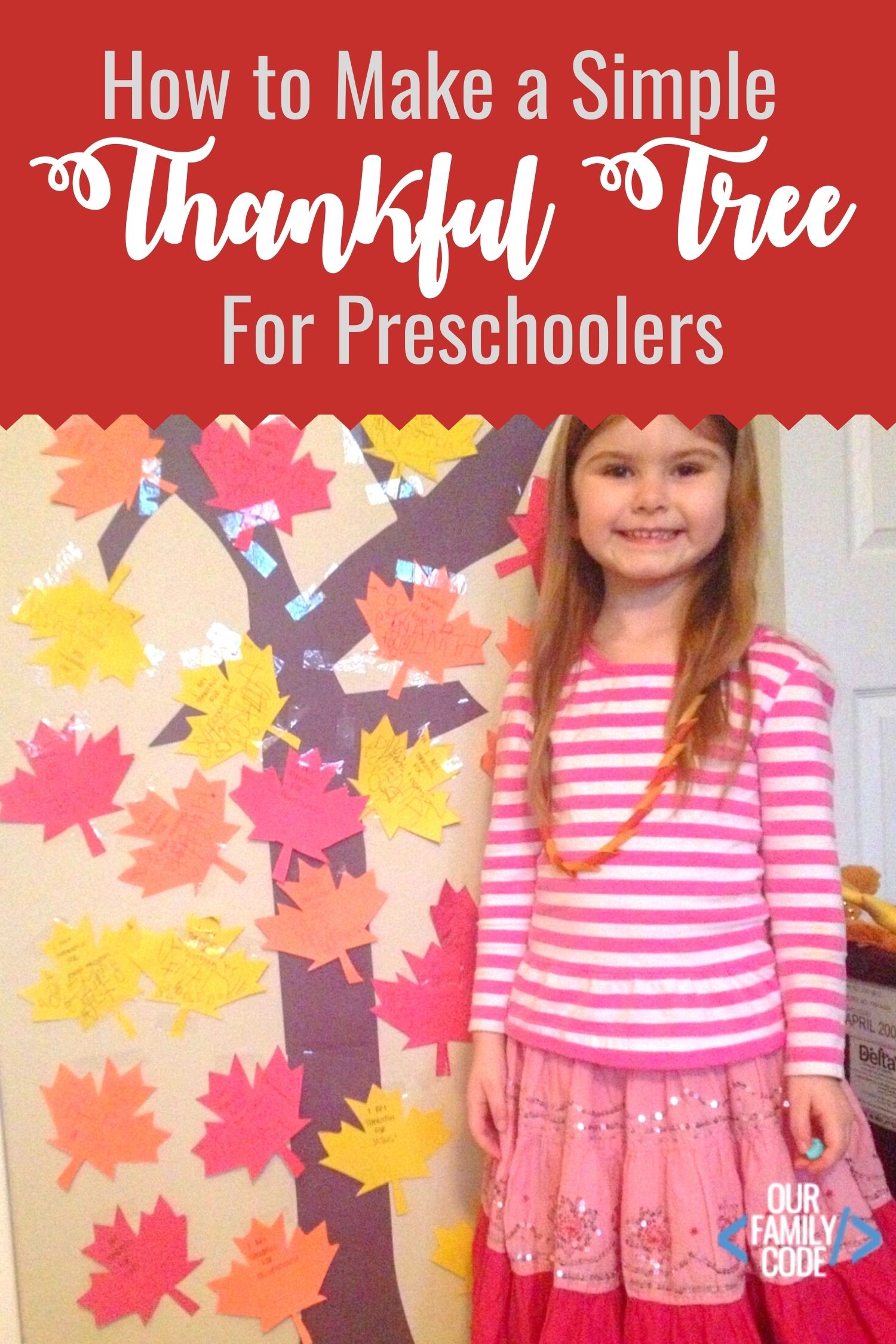 A picture of a preschooler standing in front of thankful tree.