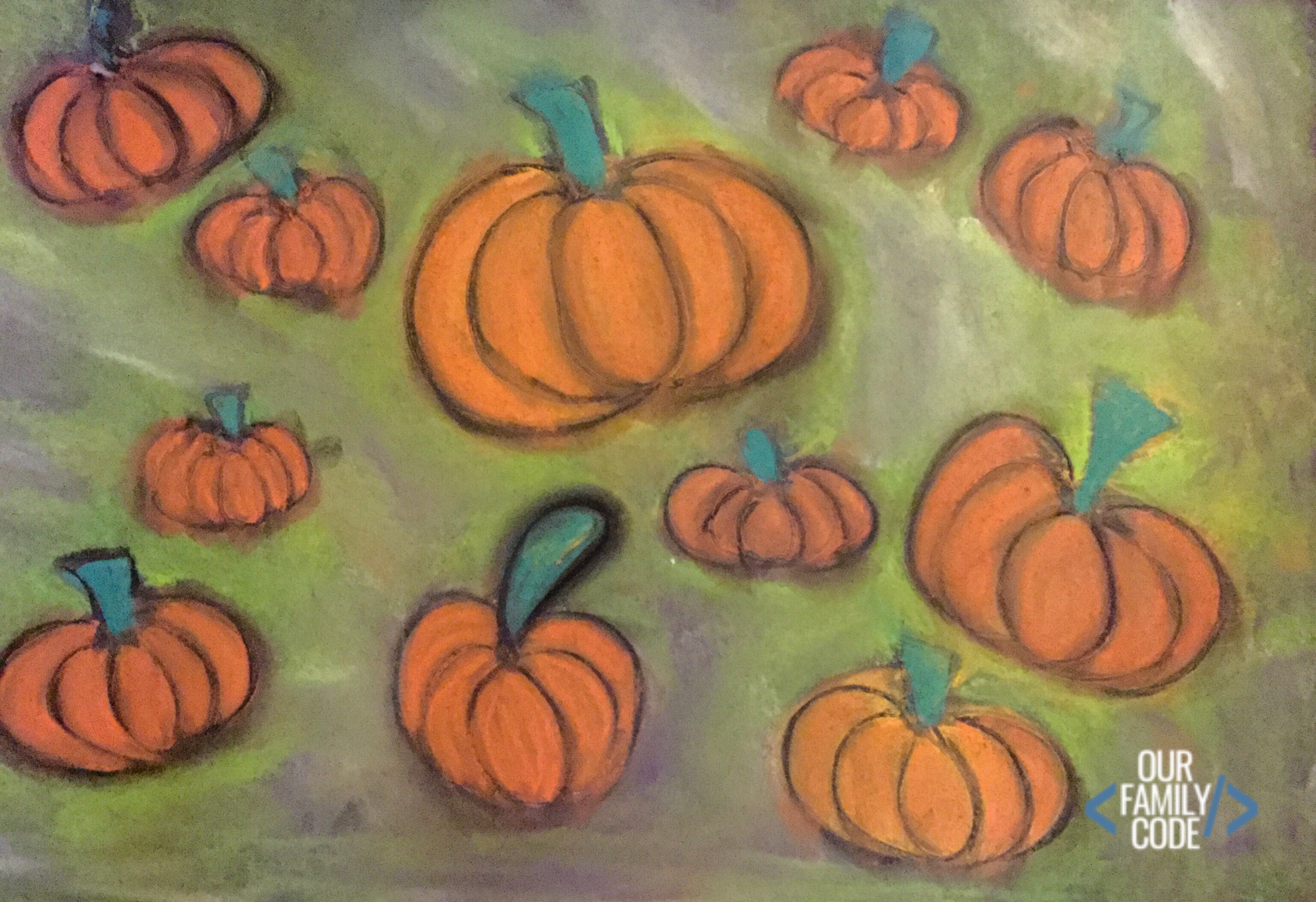 A picture of glue resist art chalk pastel pumpkins.