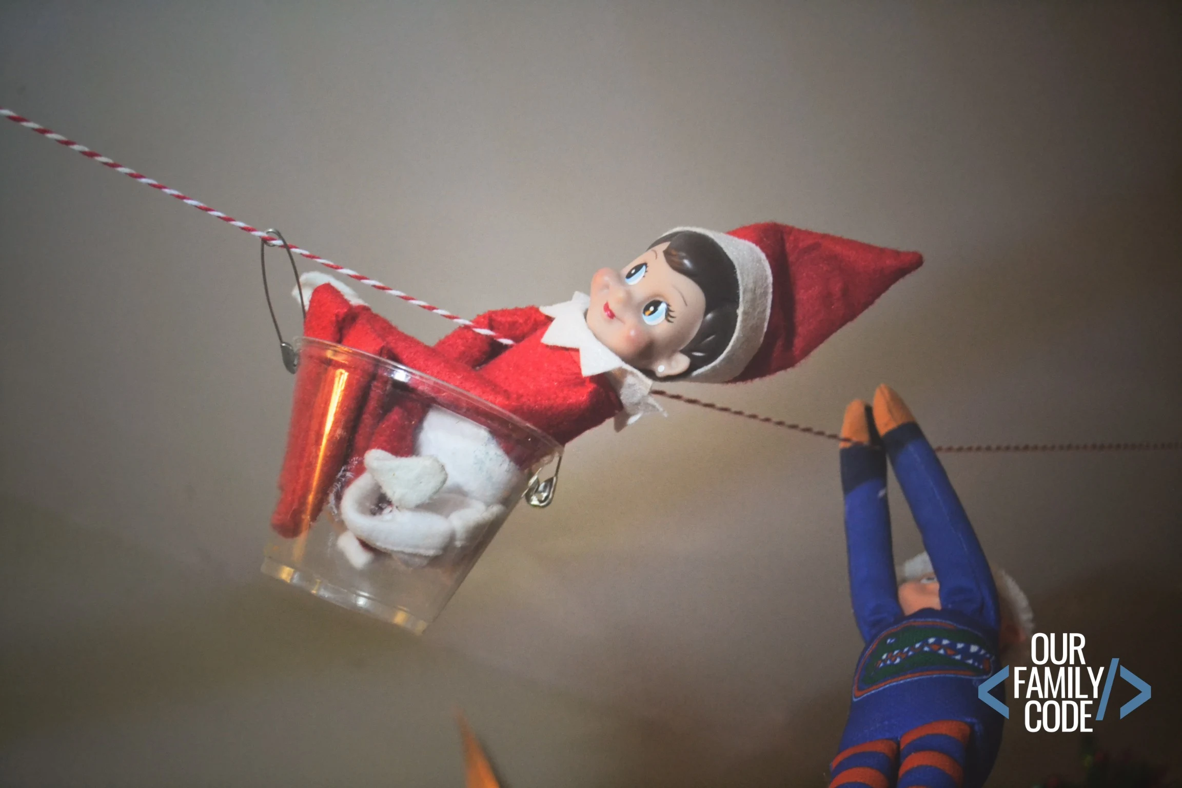 This Elf engineer zip line STEAM challenge for Elf on the Shelf is a fun way to add science to the season and learn about potential and kinetic energy! #elfontheshelf #STEAM #ChristmasSTEM #STEM