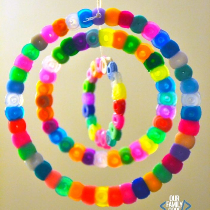 The goal of this activity is to explore the number Pi and prove that it is a mathematical constant by making math sun catchers out of perler beads for a fun math + art STEAM activity! #STEAM #PiDay #Fibonacci #mathforkids #mathart #craftsforkids #STEM #homeschool