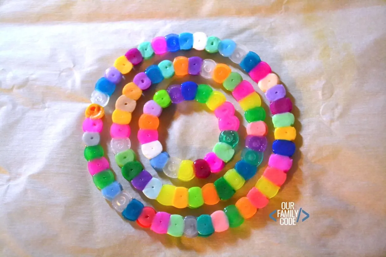 Explore the number Pi by making math sun catchers out of fuse beads for a fun math + art STEAM activity! #STEAM #PiDay #Fibonacci #mathforkids #mathart #craftsforkids #STEM #homeschool