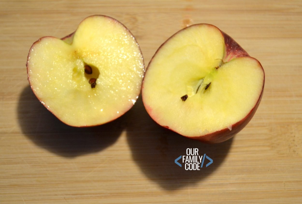 A picture of two cut apple halves.
