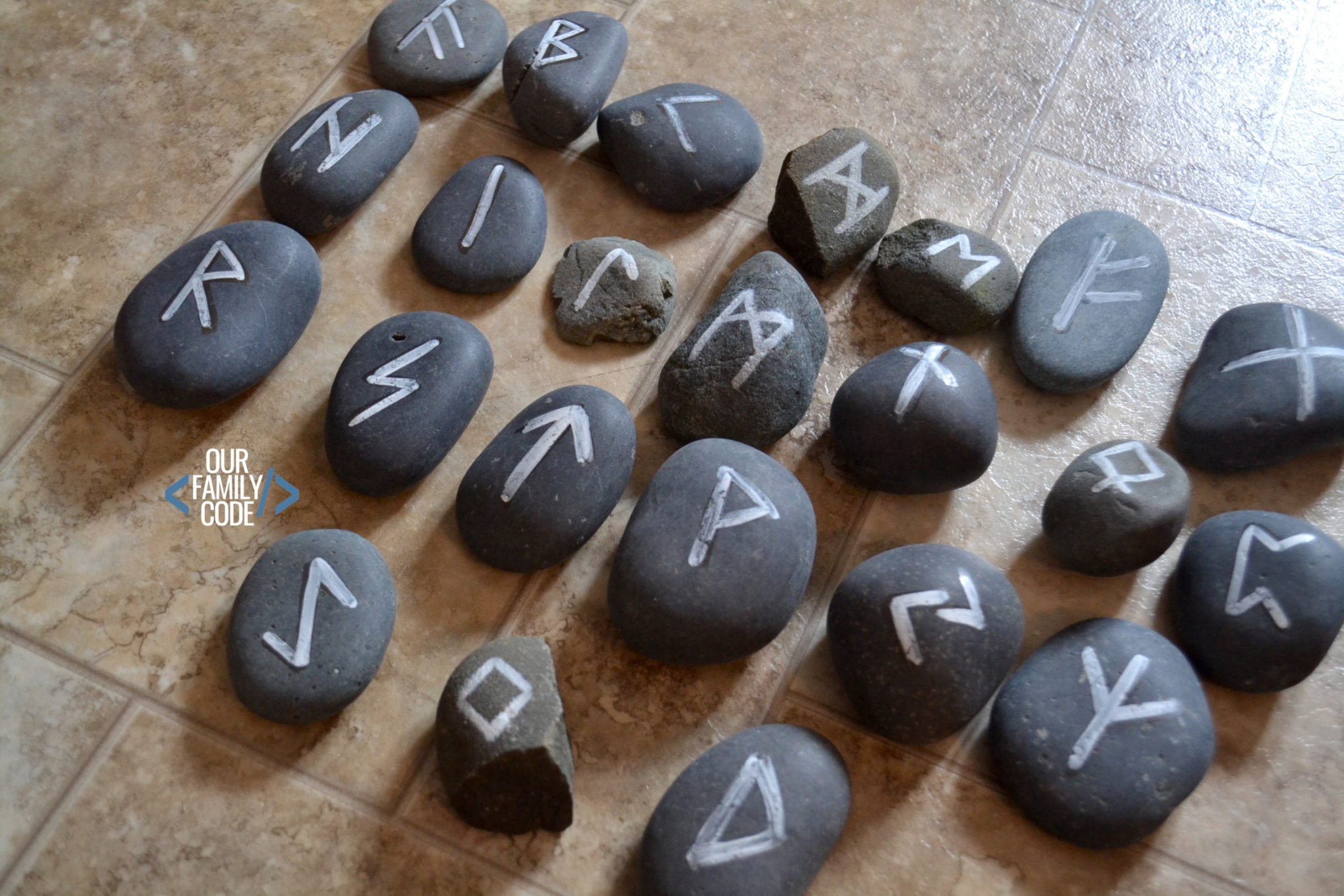 A picture of DIY rune rocks frozen steam futhark rune rocks.