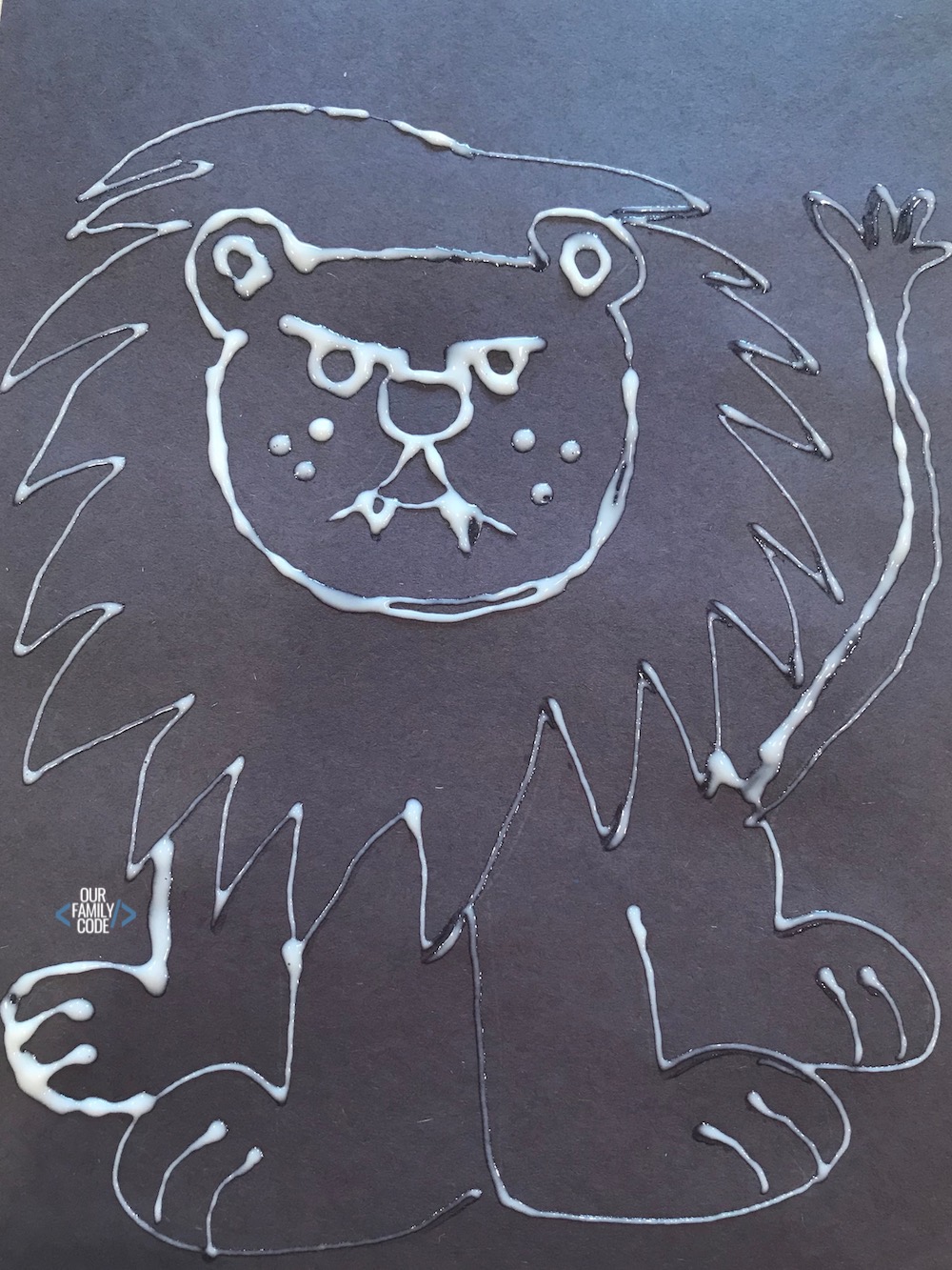 A picture of a chalk pastel glue resist art lion picture.