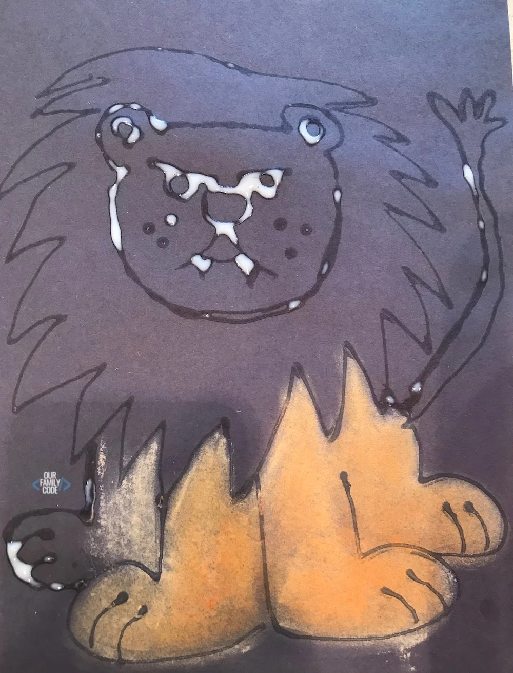 A picture of a chalk pastel glue resist art lion picture.