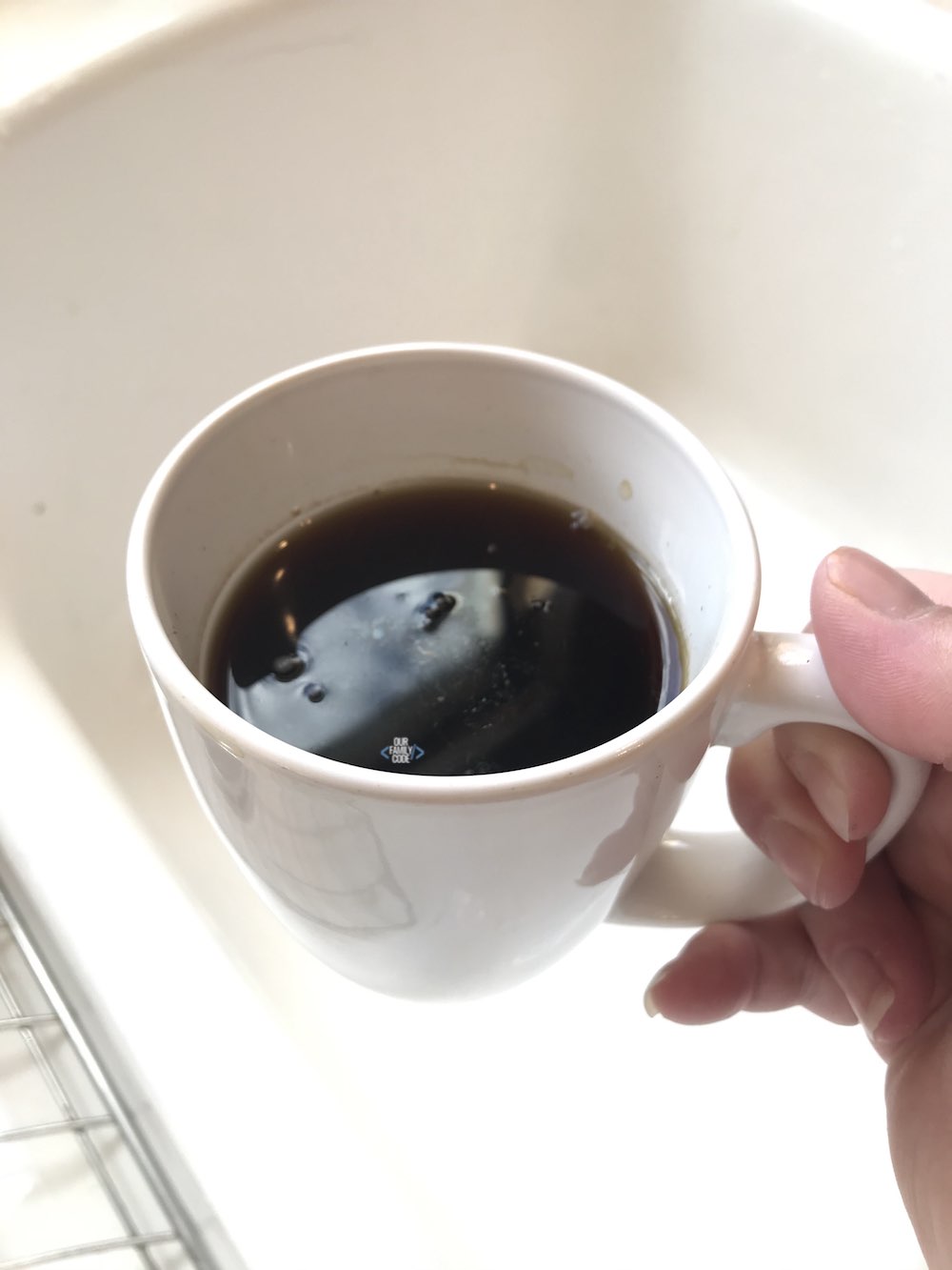 A picture of black tea in a mug.