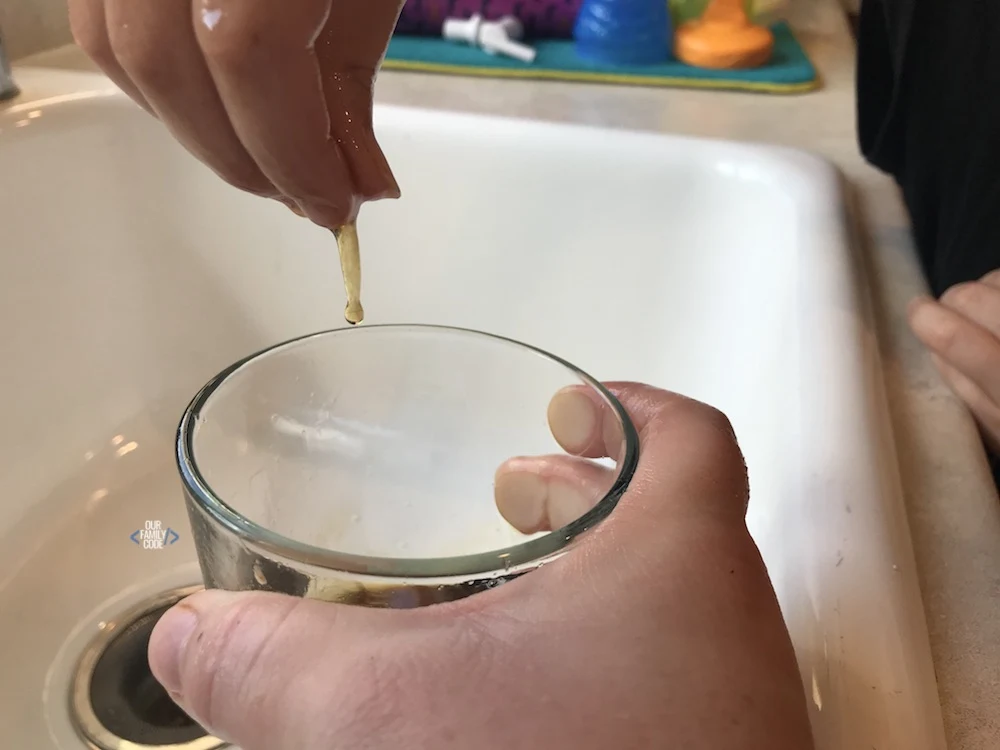 A picture of spider web science activity with sticky web made from eggs and black tea.