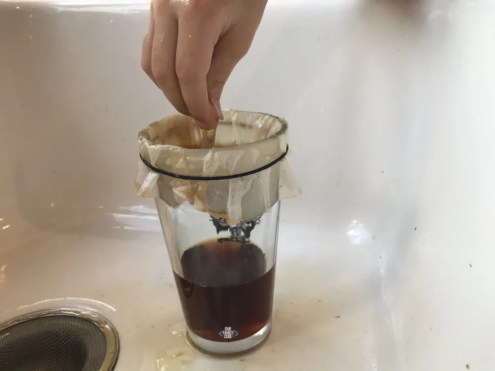 A picture of spider web science activity with sticky web made from eggs and black tea.