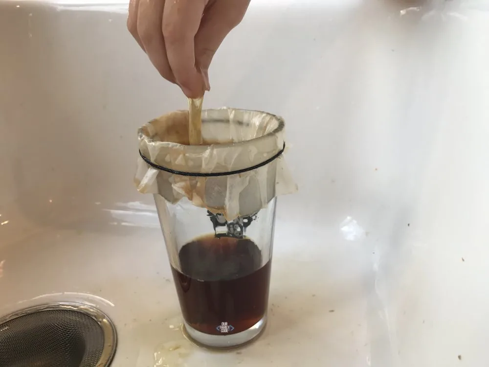 A picture of spider web science activity with sticky web made from eggs and black tea.