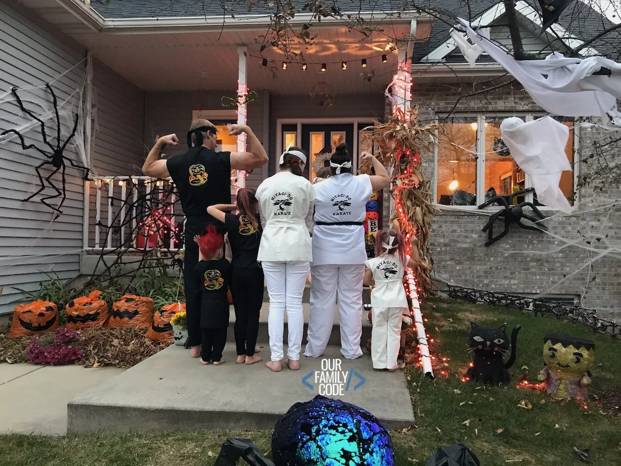 A picture of a Cobra Kai family halloween costume.