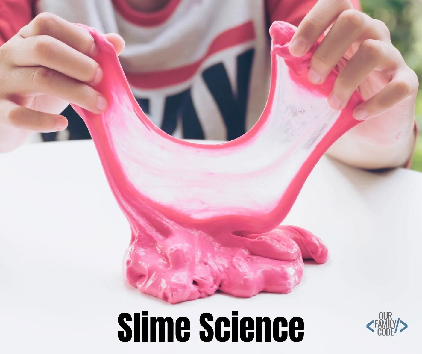 A picture of a kid stretching pink slime with the text "slime science" in black.