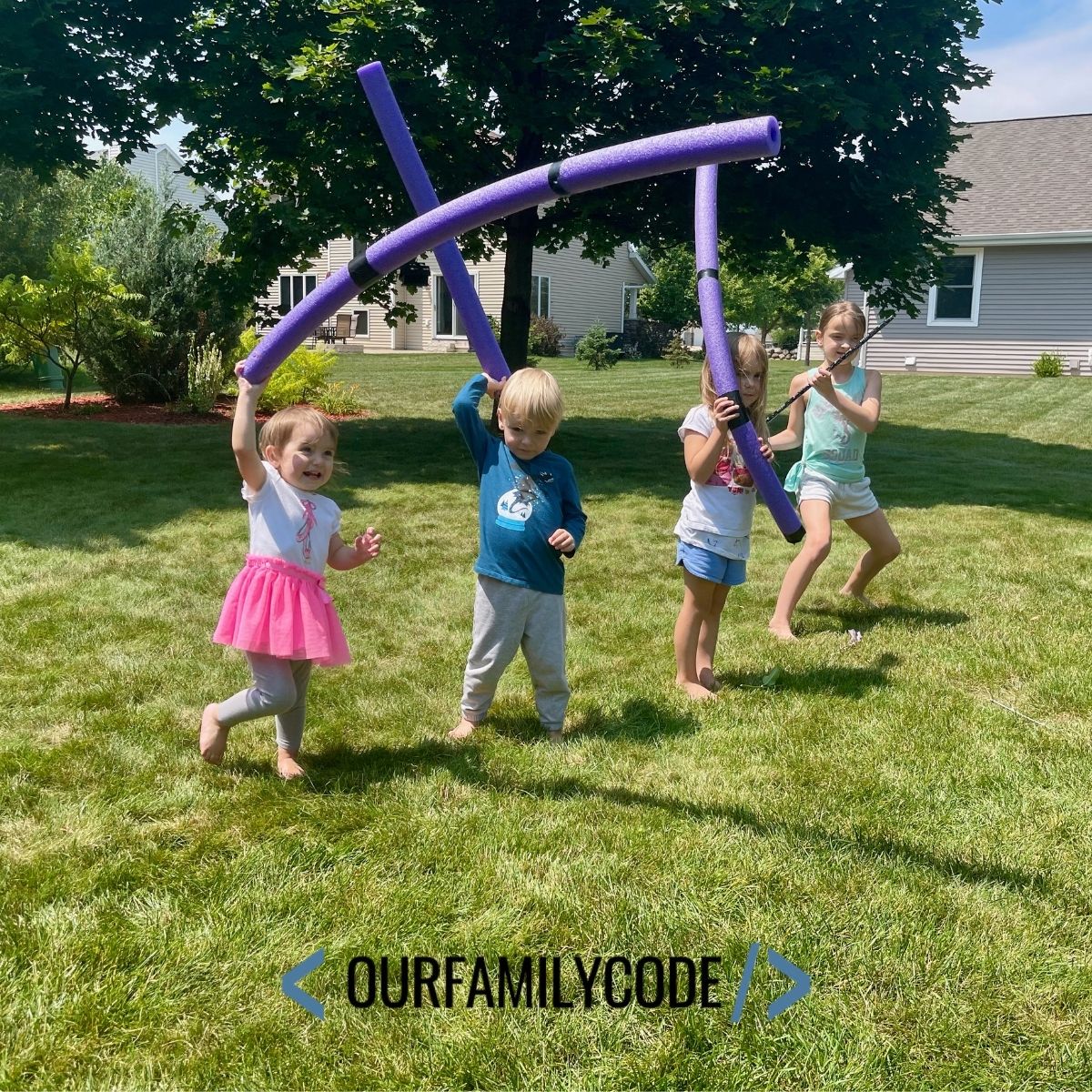 A picture of kids throwing javelin pool noodles in the backyard.